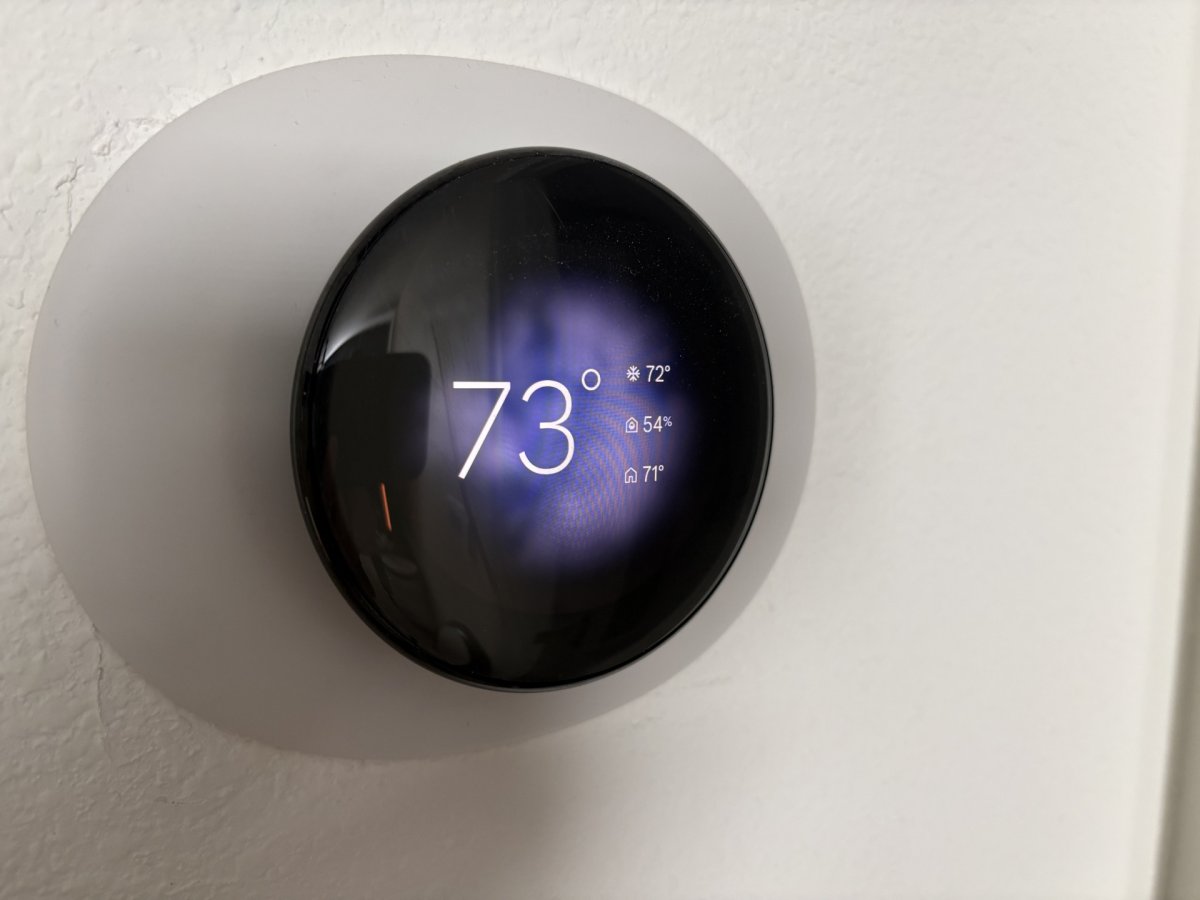 The Google Nest Smart Thermostat Gen 4 with its distinct circular glass interface.