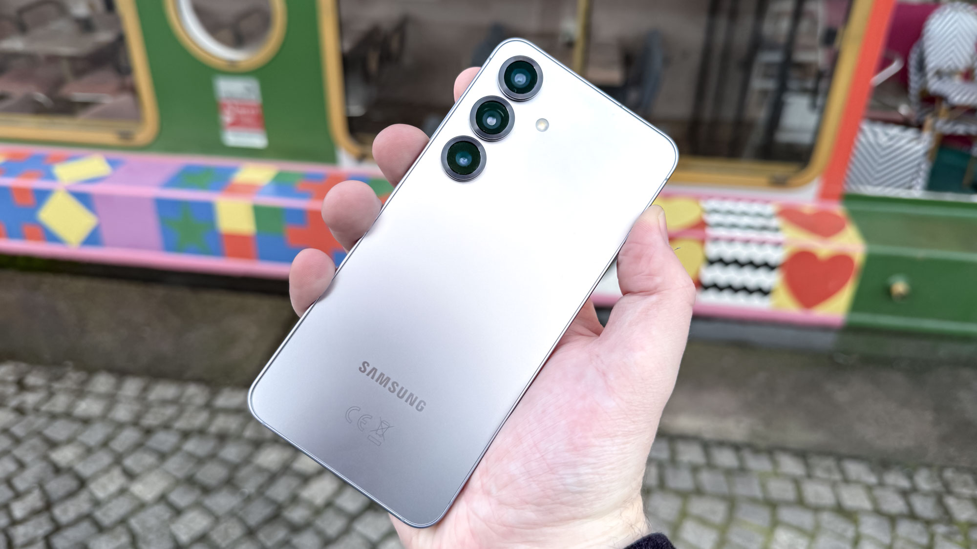 Rear view of Samsung Galaxy S25 showing the camera sensors and matte finish.