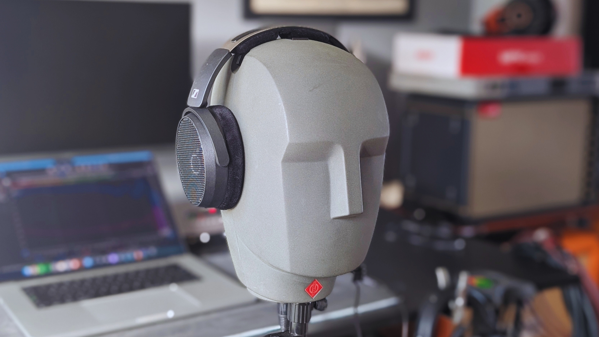 Sennheiser HD 490 Pro headphones mounted on a Neumann KU 100 binaural dummy head for testing.
