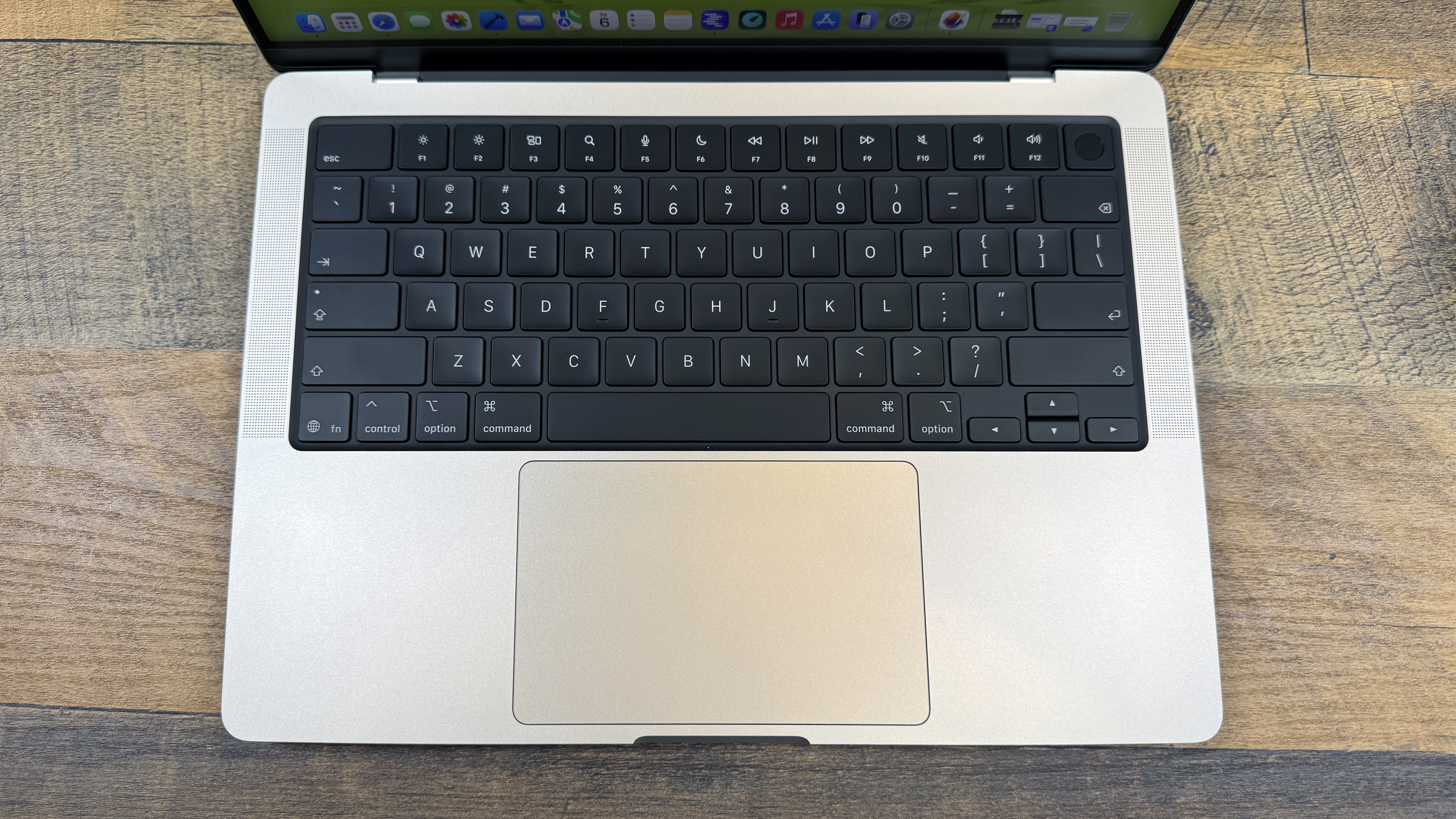 Close up of the MacBook Pro 14 keyboard and trackpad area.