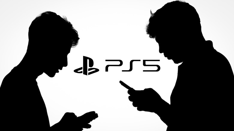 Two silhouettes holding a mobile phone in front of a glowing PlayStation logo.