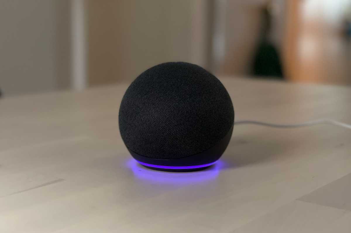 Amazon Echo speaker with a purple light ring.