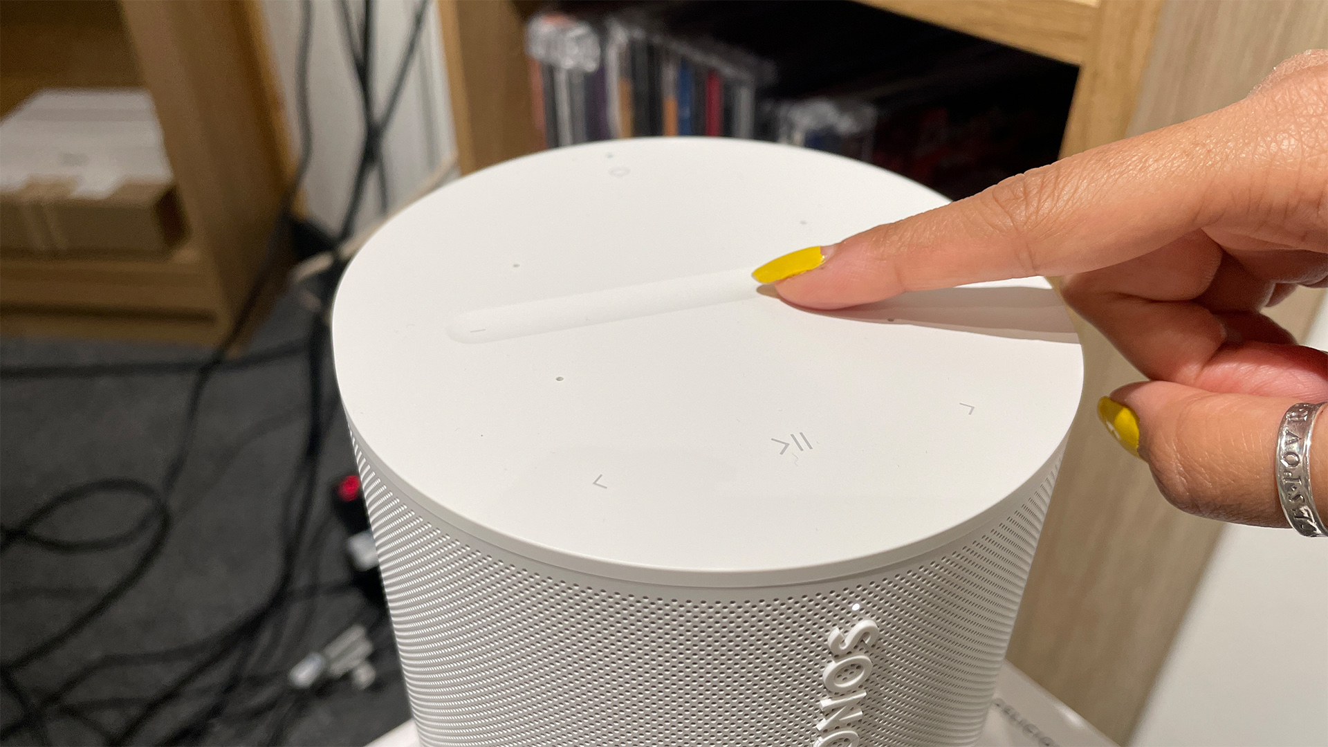 A close-up view of the volume slider and touch controls on the top of a Sonos speaker.