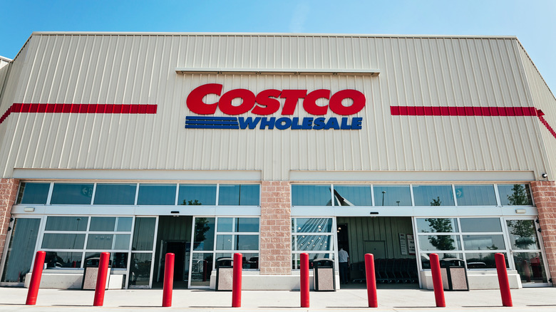 The exterior entrance of a Costco Wholesale warehouse building.