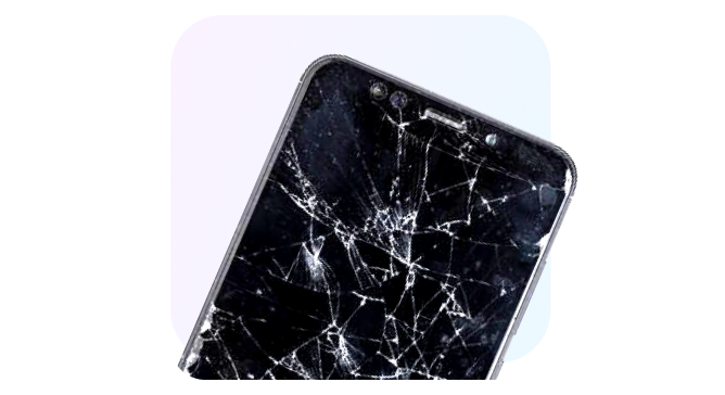 A high-resolution close-up of a smartphone with a severely cracked glass screen.