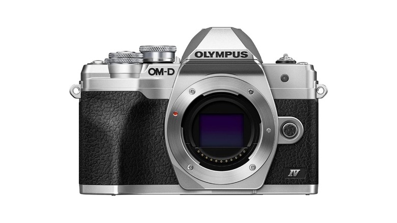 Olympus E-M10 Mark IV camera with its compact lens.