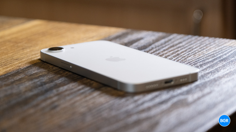 iPhone 17e resting on a wooden surface