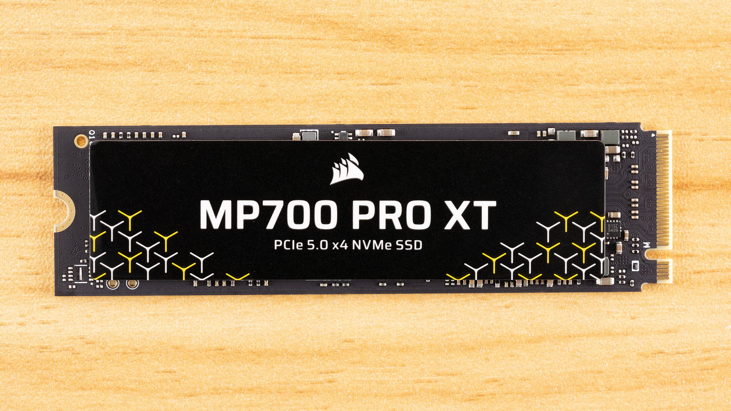 High-performance Corsair MP700 Pro XT SSD with an integrated active cooling heatsink.