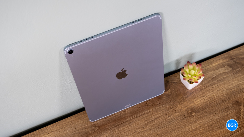 The iPad Air M3 leaning against a wall in a brightly lit room.
