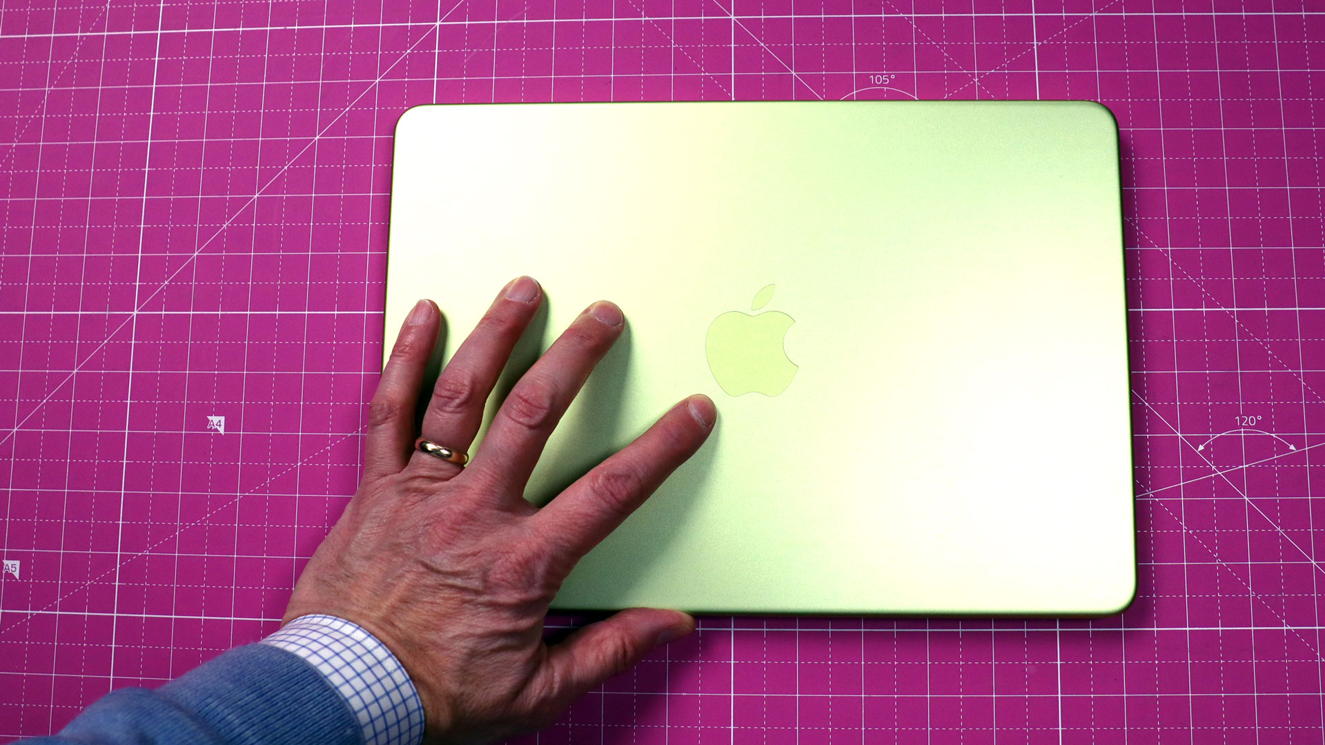 Internal view of the MacBook Neo showing the organized layout of the battery and logic board.