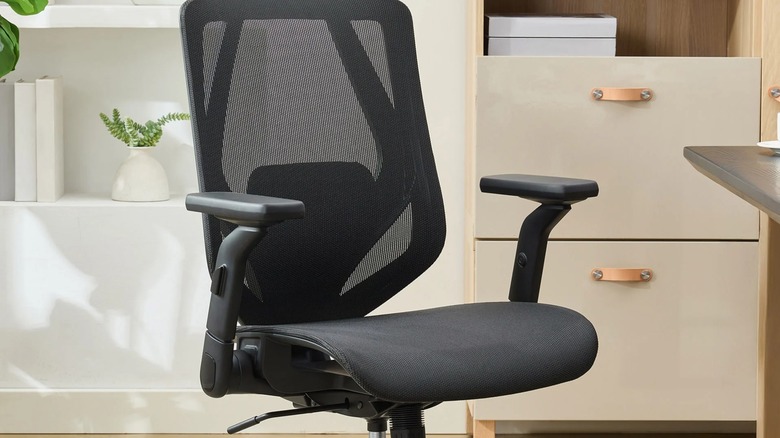 A TrueWellness ergonomic mesh office chair with lumbar support.