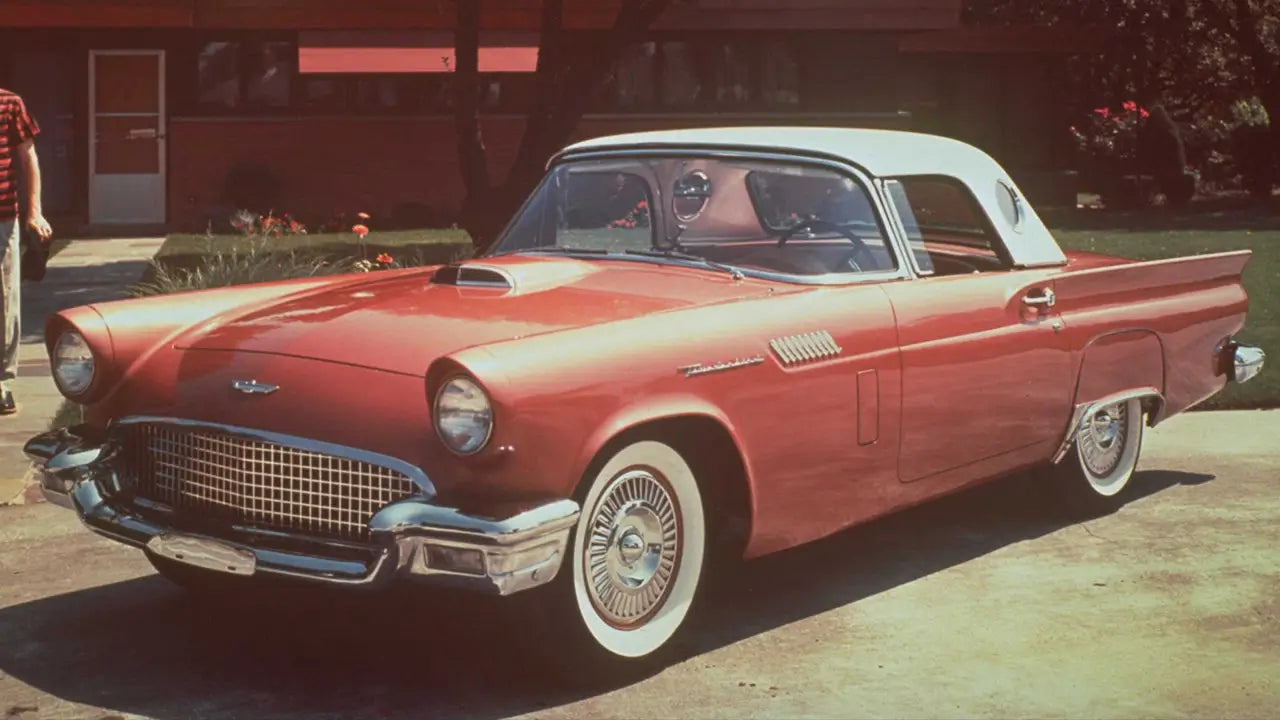 A light blue 1957 Ford Thunderbird.