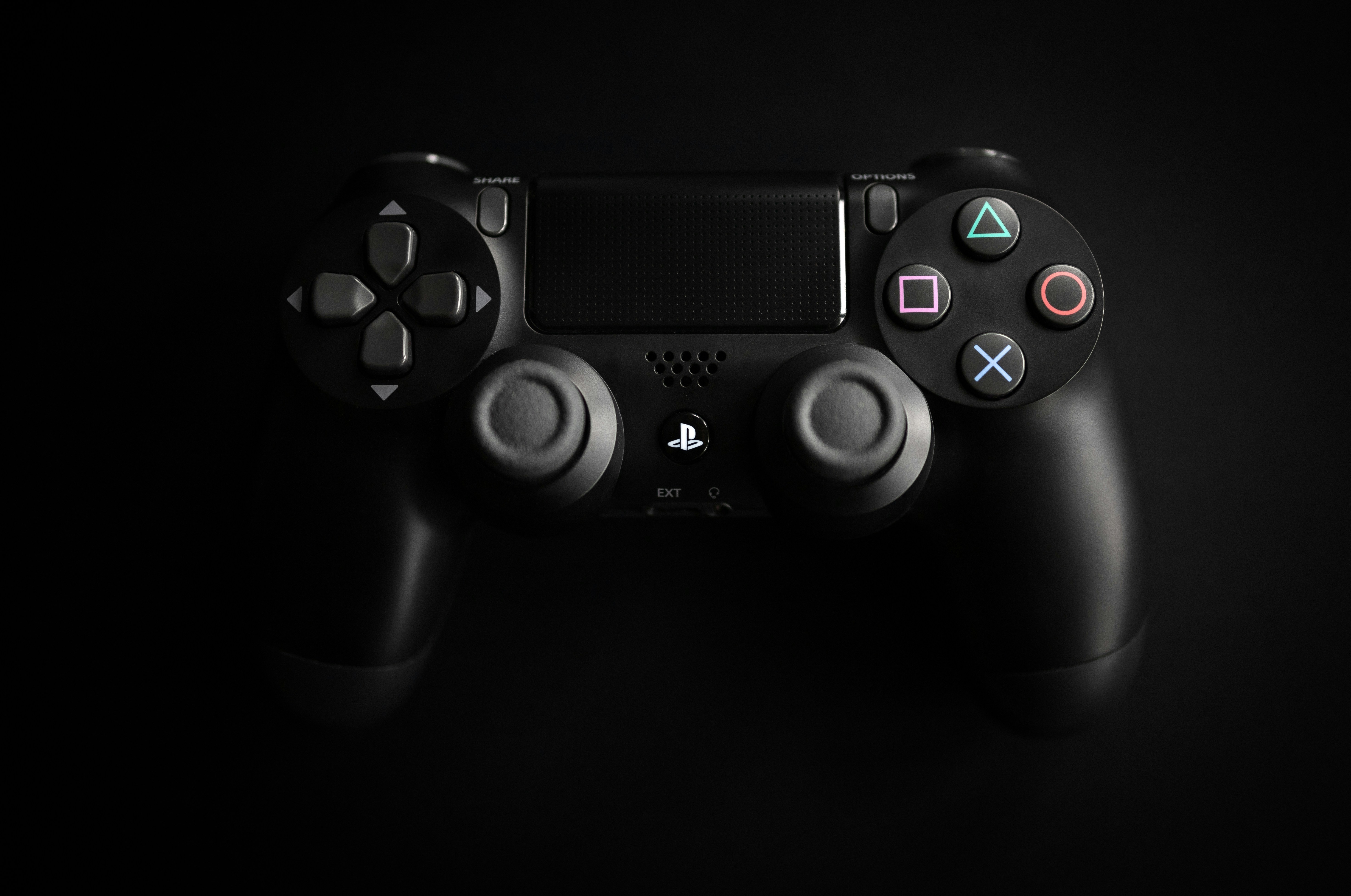 A person's hands holding a black Xbox Wireless Controller during gameplay.