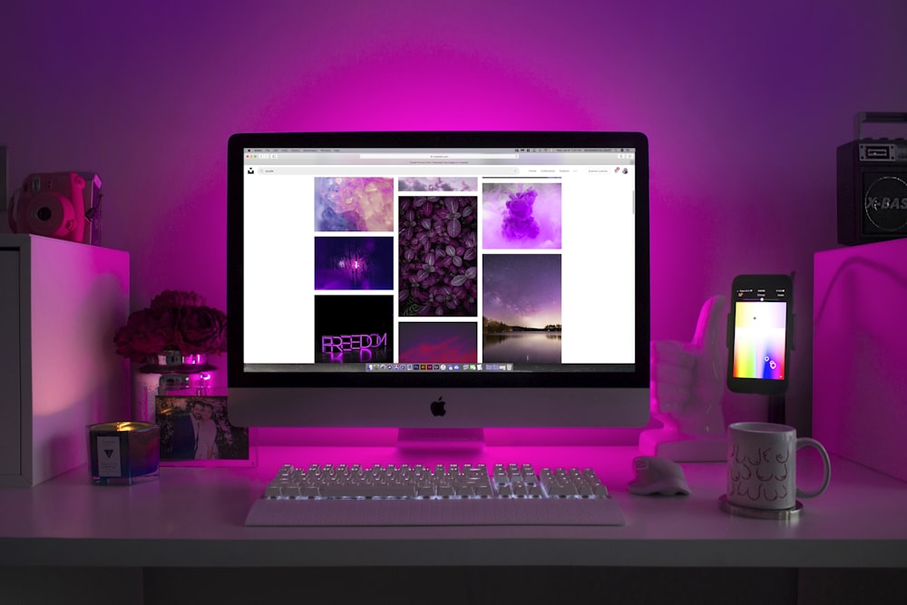 A home office setup featuring a desktop monitor, keyboard, and computer tower.