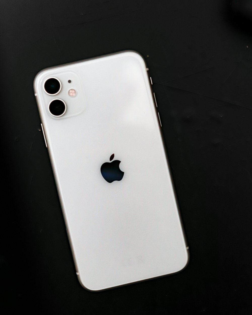 Extreme close-up of the dual-lens camera module on the back of an iPhone 17.
