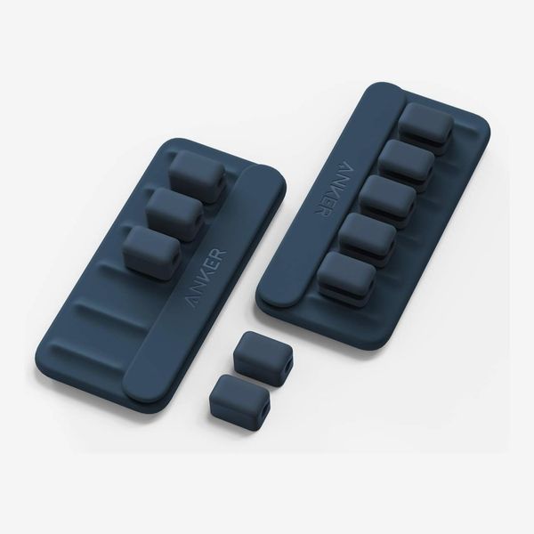 The retail packaging and components of the Anker Magnetic Cord Keeper.