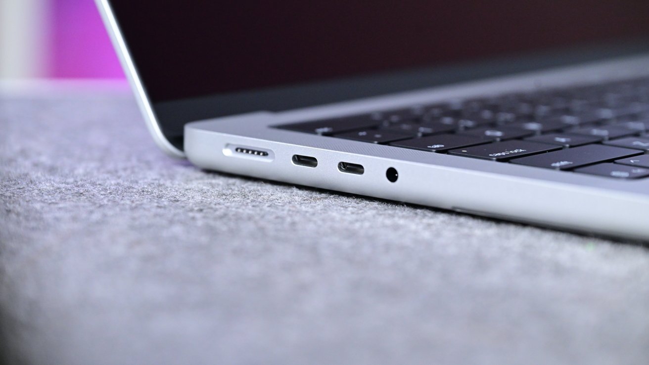Close-up side view of a MacBook Pro featuring Thunderbolt 5 ports and a MagSafe connector.