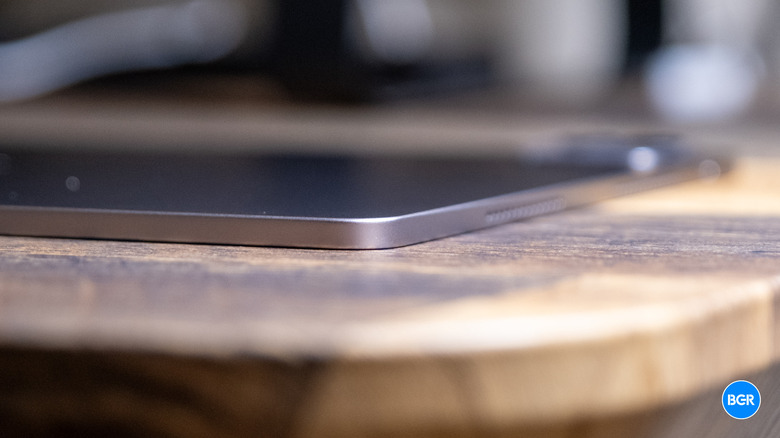 Side profile close-up showing the extreme thinness of the Honor MagicPad4.