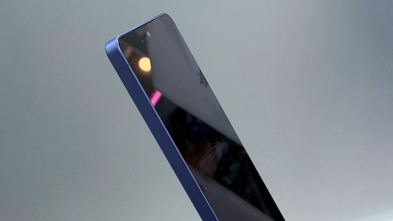 A side-angle view of the Samsung Galaxy S26 Ultra showing the Privacy Display feature darkening the screen for observers.