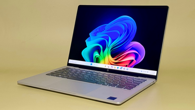 HP OmniBook 5 14 laptop against a vibrant yellow background.