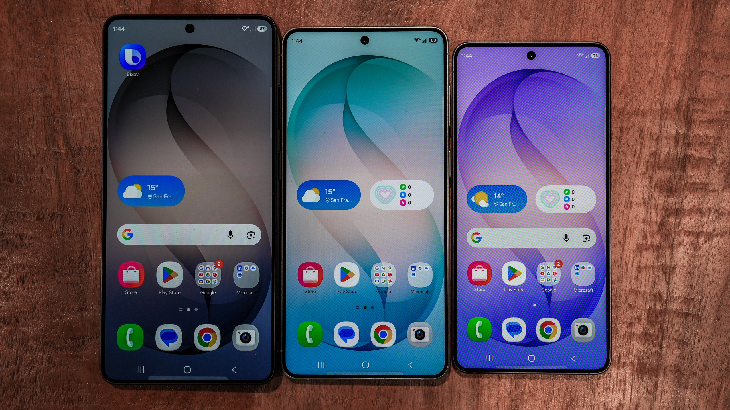 The display screens of the Samsung Galaxy S26 series lineup showing colorful wallpapers.