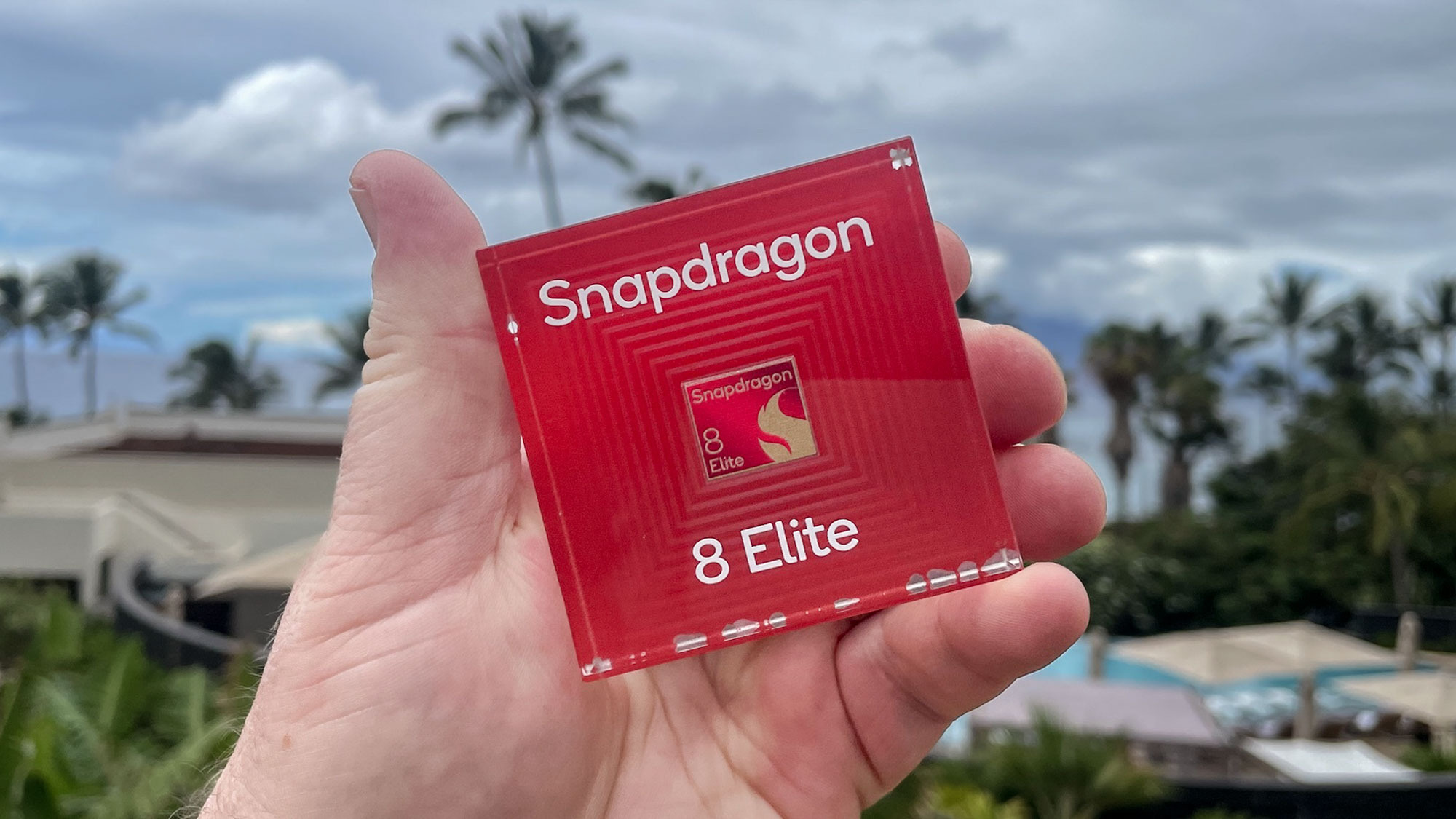Qualcomm Snapdragon 8 Elite chipset held in hand.