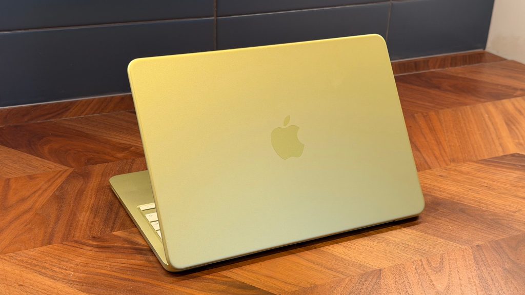 Detailed view of the MacBook Neo's mechanical trackpad and keyboard area.